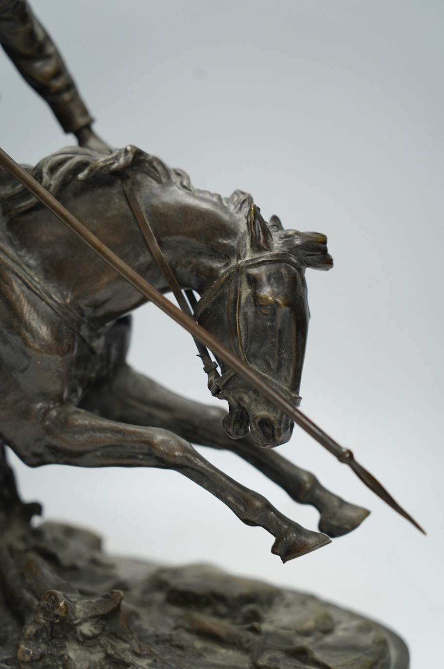 After Eugene Lanceray (Russian, 1848-1886), bronze study of a Cossack charging, signed in cyrillic, 39cm wide. Condition - good